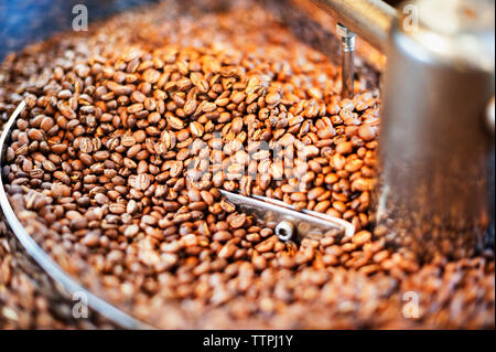Close up of coffee beans in coffee roaster Stock Photo
