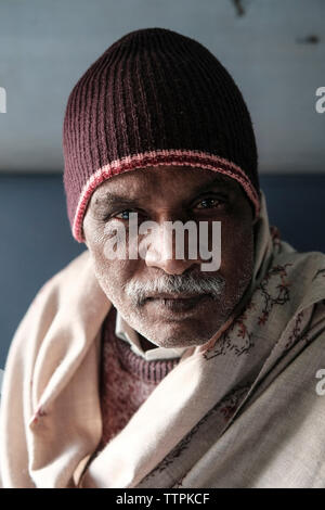 Portrait of mature man wearing warm clothing in train Stock Photo