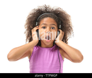 Cute African American girl listening music, isolated on white Stock Photo