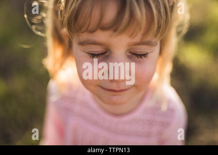 Close up portrait of young girl with eyes closed Stock Photo