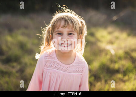Portrait of young girl smiling at camera Stock Photo