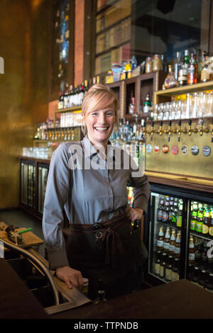 Portrait of happy female bartender Stock Photo