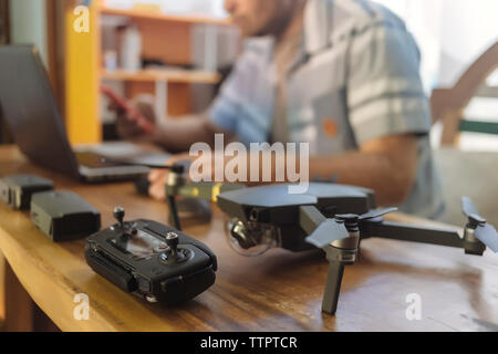 Midsection of engineer using laptop at table in office Stock Photo