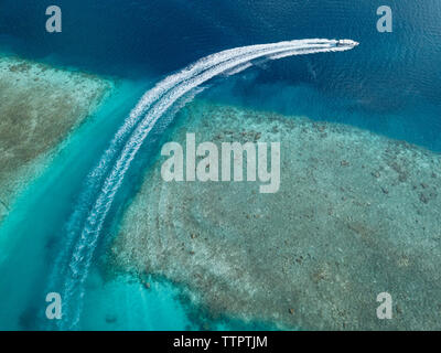 Aerial view of boat on sea at Maldives during sunny day Stock Photo