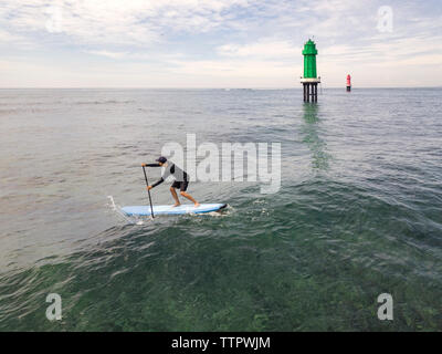 Aerial view of stand up paddle surfing Stock Photo