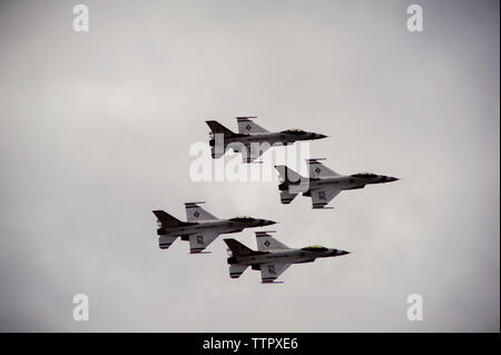 Low angle view of fighter planes in clear sky during airshow Stock Photo