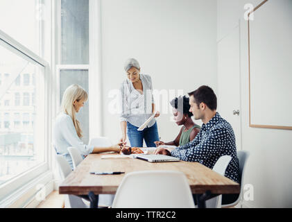 business team discussing strategy in board room Stock Photo