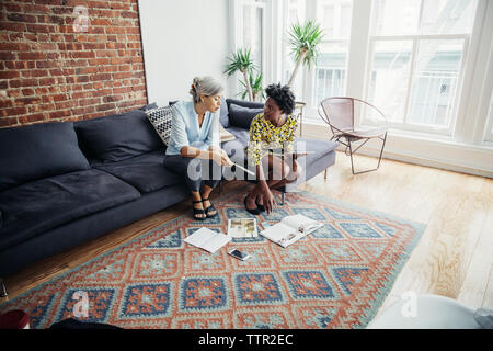 businesswomen discussing on creative office Stock Photo