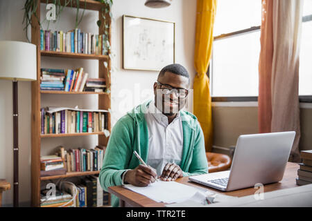 Portrait of happy man working at home Stock Photo
