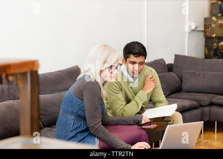 business people using laptop during meeting in creative office Stock Photo