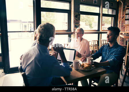 businessman discussing in meeting while having coffee at cafe Stock Photo