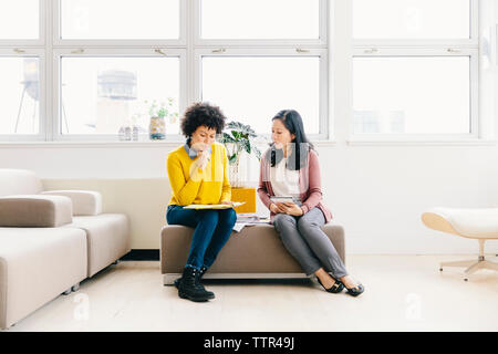 Serious businesswomen working together in office Stock Photo