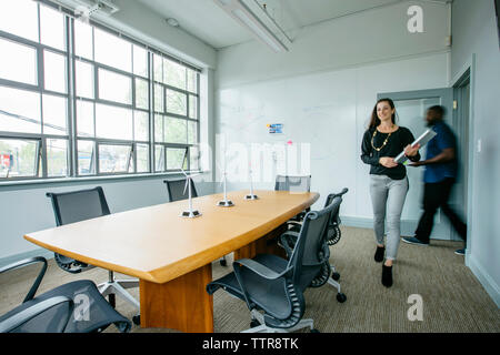 Blurred motion of business people entering in boardroom Stock Photo