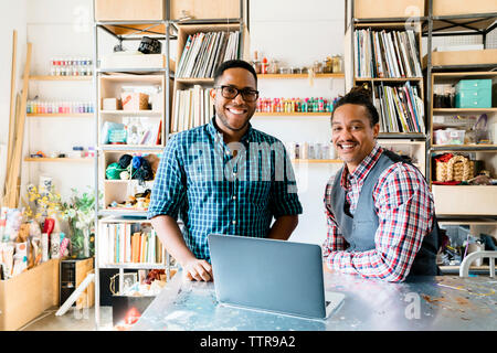 Portrait of happy businessmen working in office Stock Photo