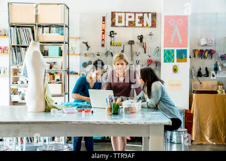 businesswomen working on laptop computer in creative office Stock Photo
