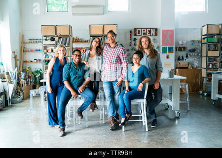 Full length portrait of happy business people in office Stock Photo