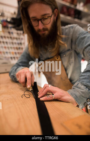 Leather craft tools on cutting mat Stock Photo - Alamy