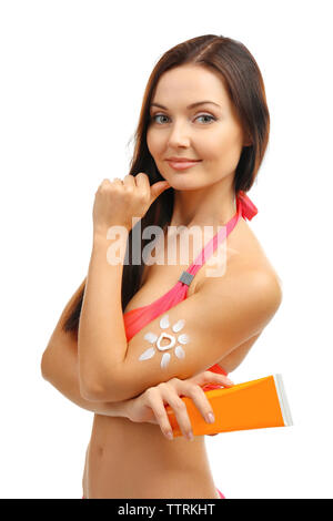 Beautiful girl with sun protection lotion on white background Stock Photo