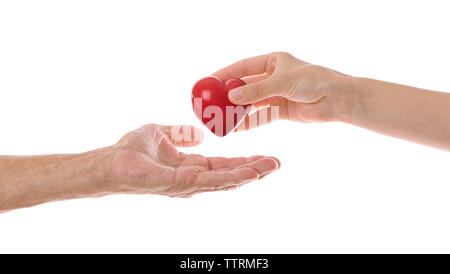 Old male and young female hands with heart figure on white background Stock Photo