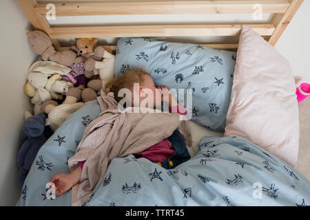 High angle view of girl sleeping in bed at home Stock Photo