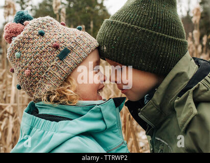 Kids playing in the snow Stock Photo - Alamy
