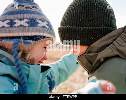 brother and sister laughing together having hun playing outdoors Stock Photo