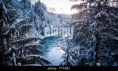 Winter Sunset on a blue river in North Bend, Washington Stock Photo