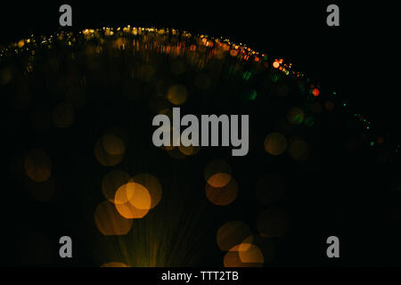 Abstract image of illuminated fiber optics against black background Stock Photo