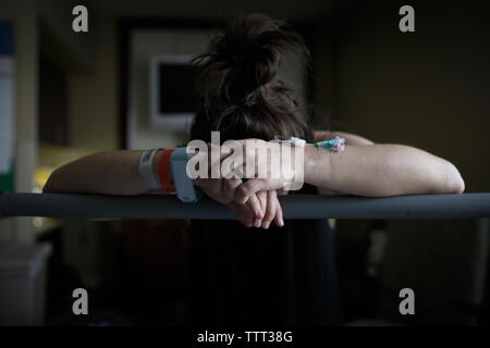 Painful pregnant woman in hospital ward Stock Photo