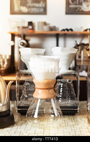 Close-up of coffee maker on table in cafe Stock Photo