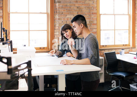 business people discussing plan while working in office Stock Photo