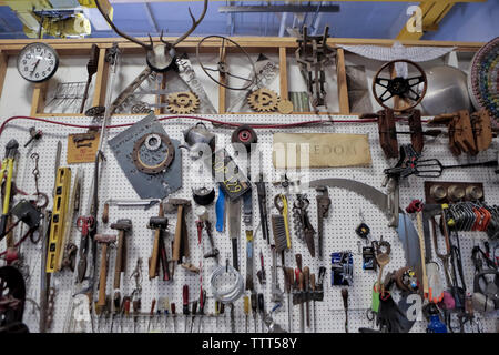 Various equipment hanging on pegboard in automobile industry Stock Photo