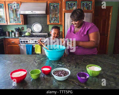 Mother and son baking cookies in the kitchen Stock Photo