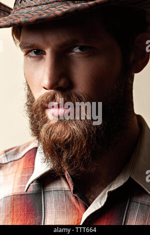 Young handsome man in a cowboy hat Stock Photo