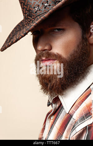 Young handsome man in a cowboy hat Stock Photo