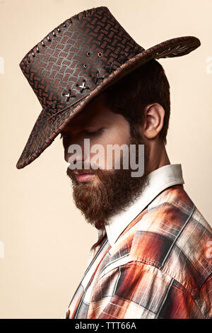 Young handsome man in a cowboy hat Stock Photo