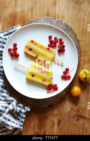 Close-up of flavored ice in plate on table Stock Photo