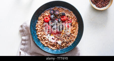 Overhead view of breakfast served in bowl with napkin on table Stock Photo