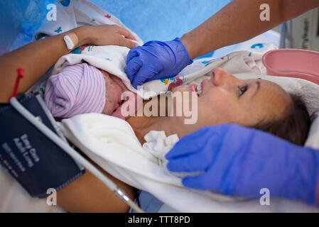 Newborn baby boy sleeping in crib at hospital Stock Photo