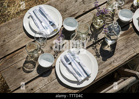 Overhead view of crockery and silverware on table Stock Photo