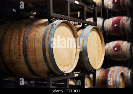 Wooden barrels in wine cellar Stock Photo