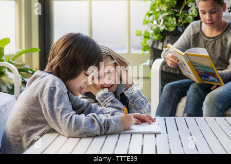 Children studying in room during field trip Stock Photo