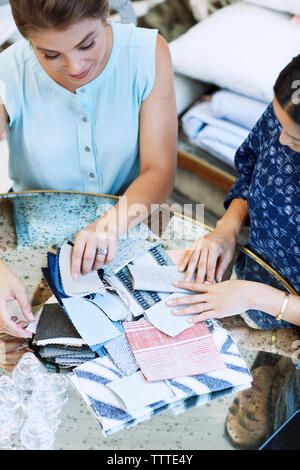 Interior designers brainstorming with swatches in office Stock Photo ...