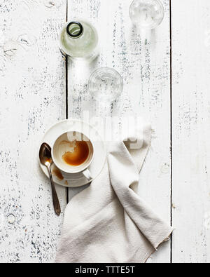 High angle view of leftovers with napkin on wooden table Stock Photo