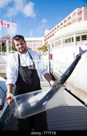 BERMUDA. Hamilton Parish. Marcus' Restaurant kitchen staff with freshly caught fish. Bought from a local fisherman, it will be for the Marcus' Restaur Stock Photo