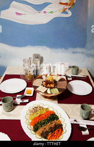 RUSSIA, Moscow. Table with food at Koryo, a North Korean restaurant in Moscow. Stock Photo