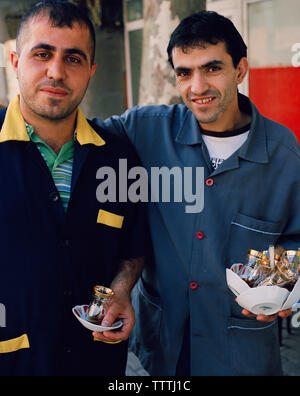 TURKEY, Istanbul, portrait of mid adult men holding tea cups Stock Photo