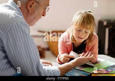 Grandfather and granddaughter at home Stock Photo