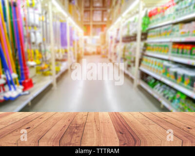 Empty wood table top on shelf in supermarket blurred background Stock Photo