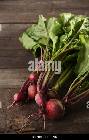 Bunch of young beets on wooden background Stock Photo